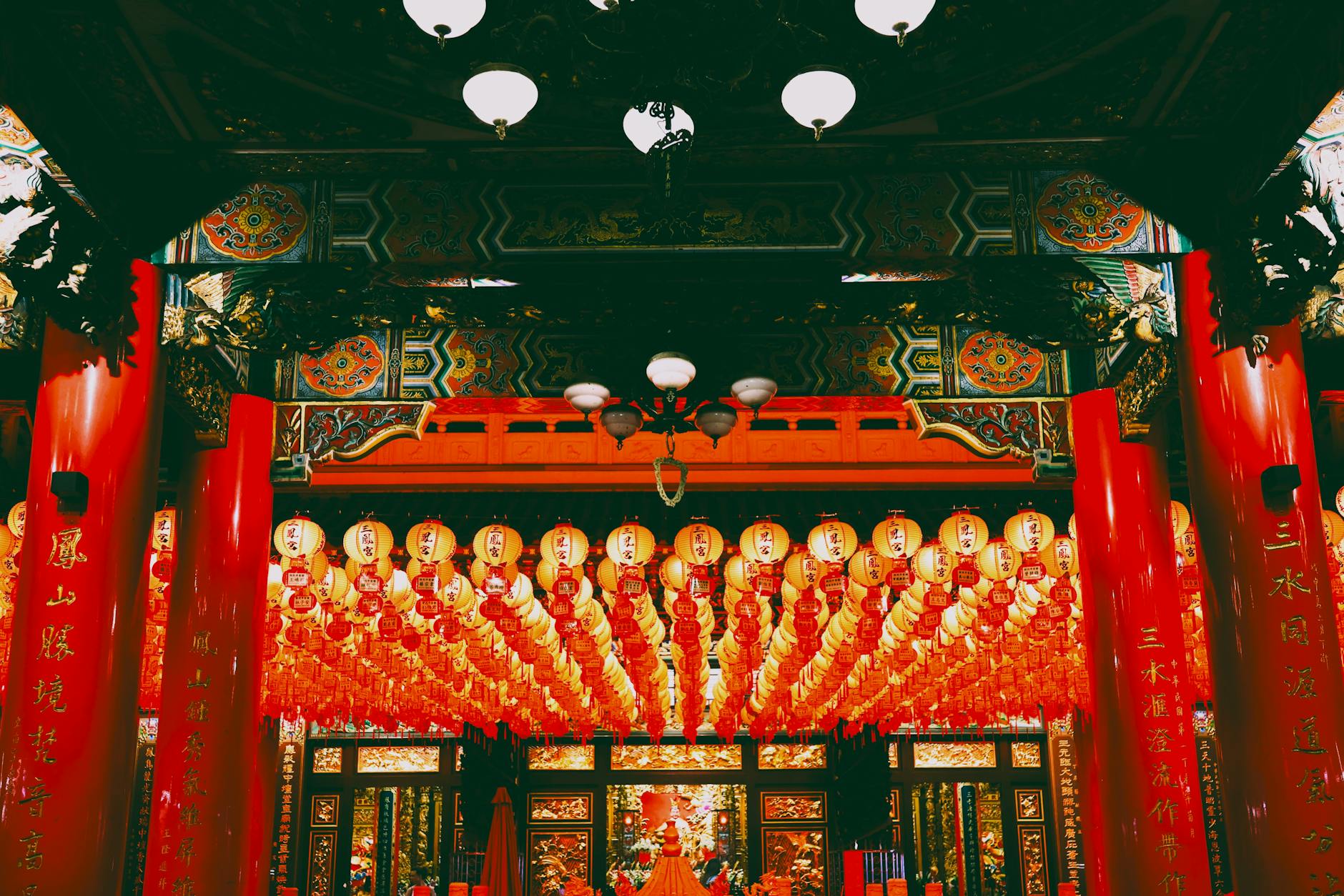 Vibrant interior of a Taiwanese temple adorned with red lanterns