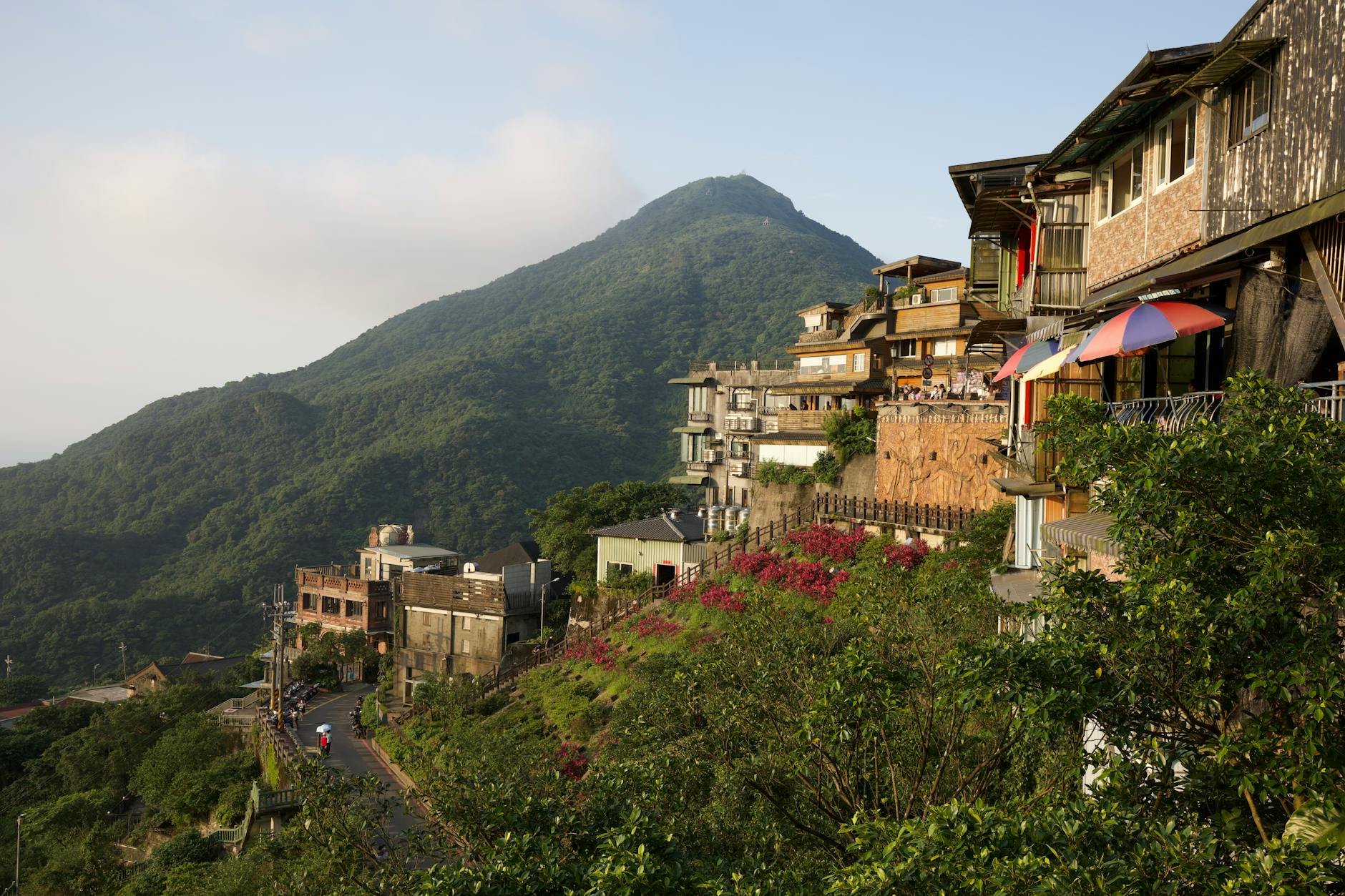 Charming view of Jiufen village on a lush hillside in Taiwan overlooking the mountains and sea