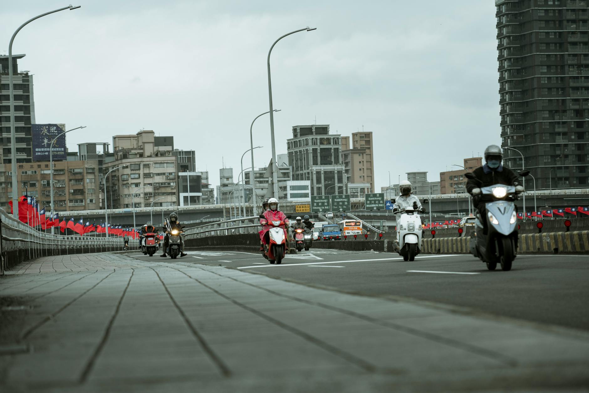 Taipei street scene with scooters and shop signs