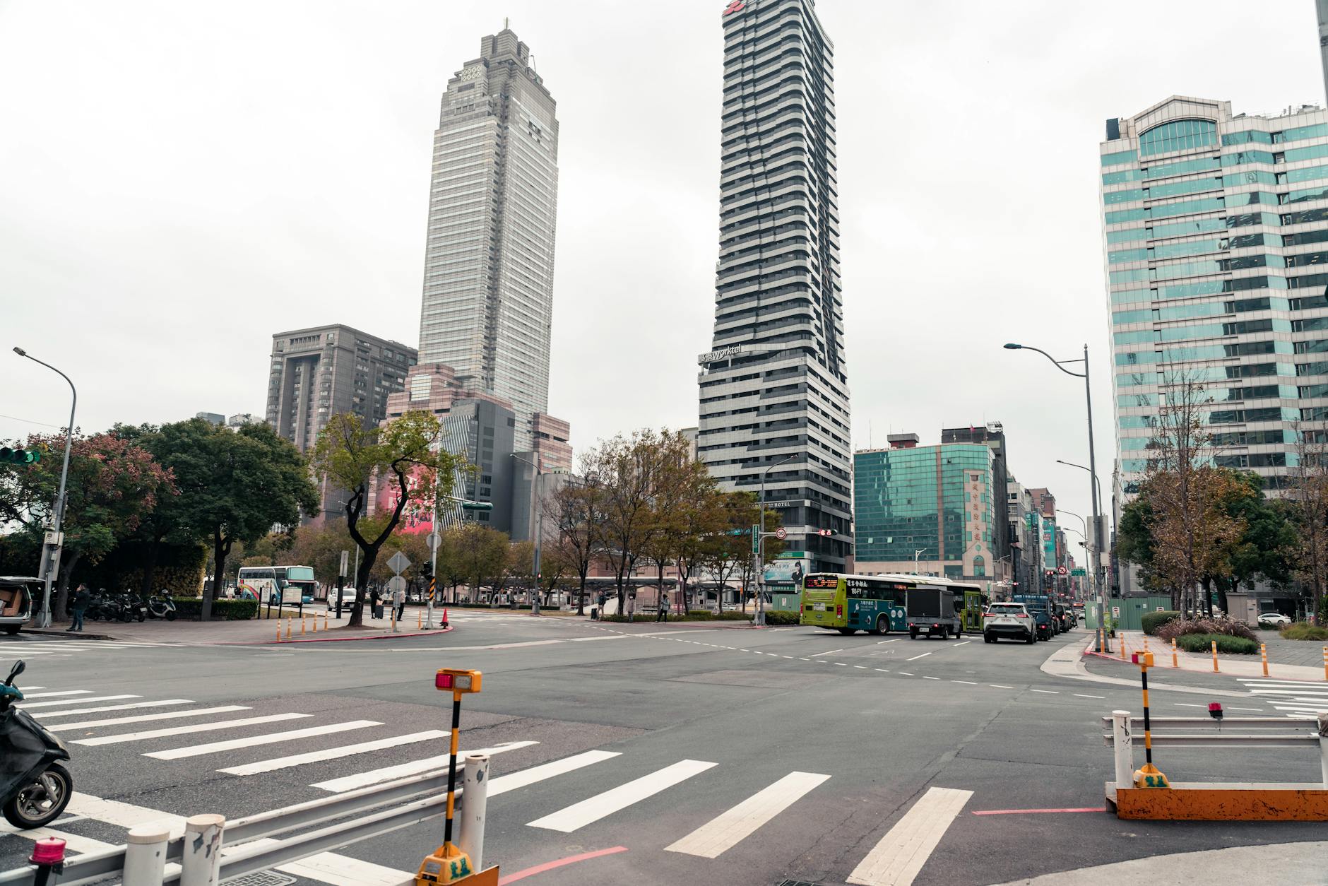 Bustling intersection in Taipei's Xinyi District showcasing modern skyscrapers