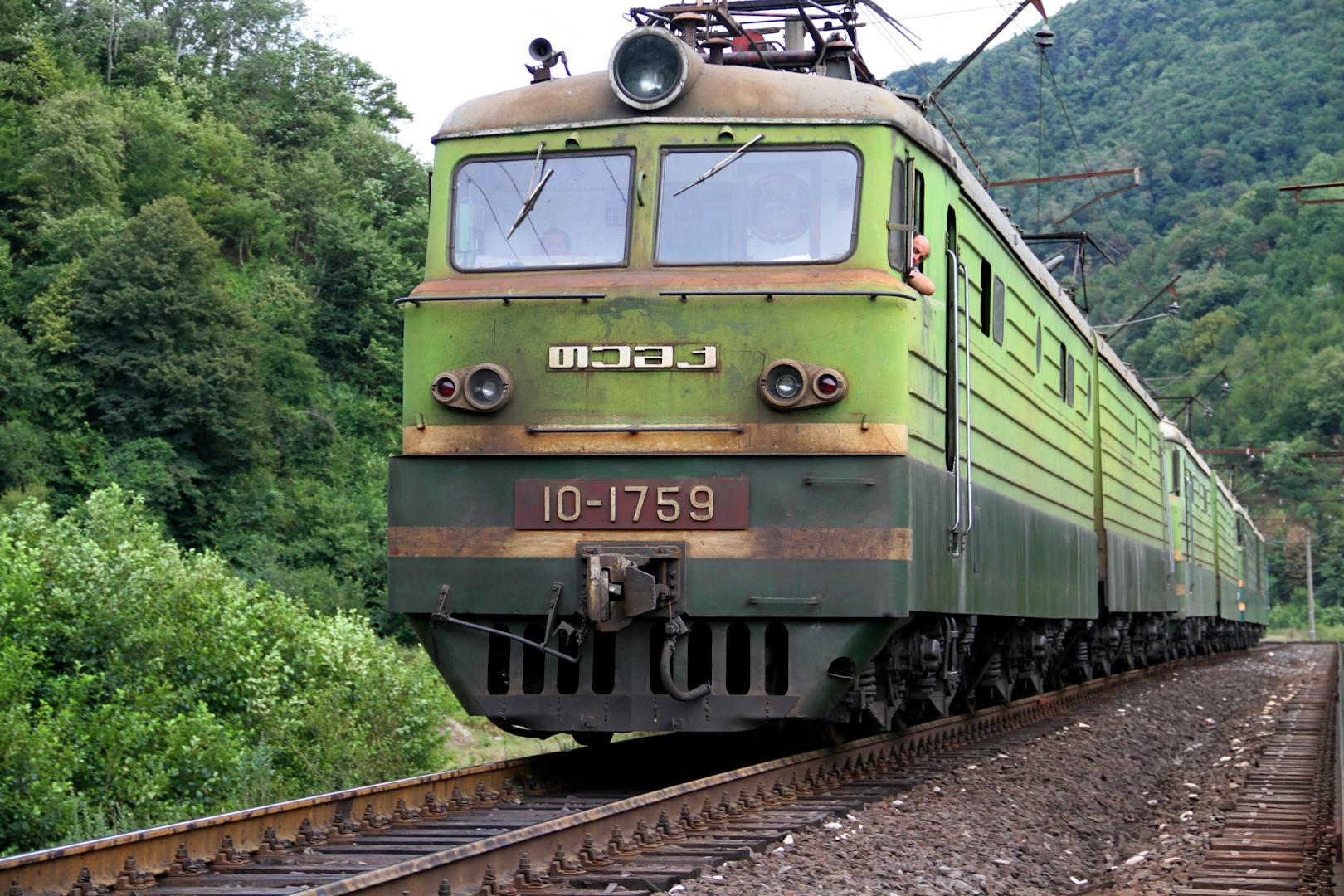 Alishan Forest Railway train winding through mountain forest