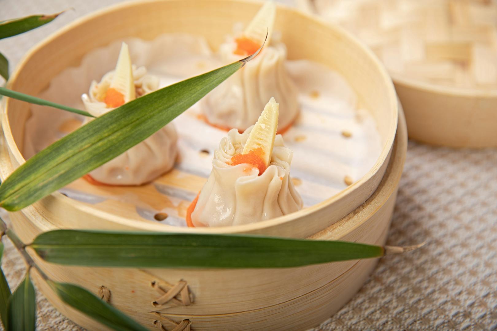 Bamboo steamer with dim sum dumplings at Taipei restaurant