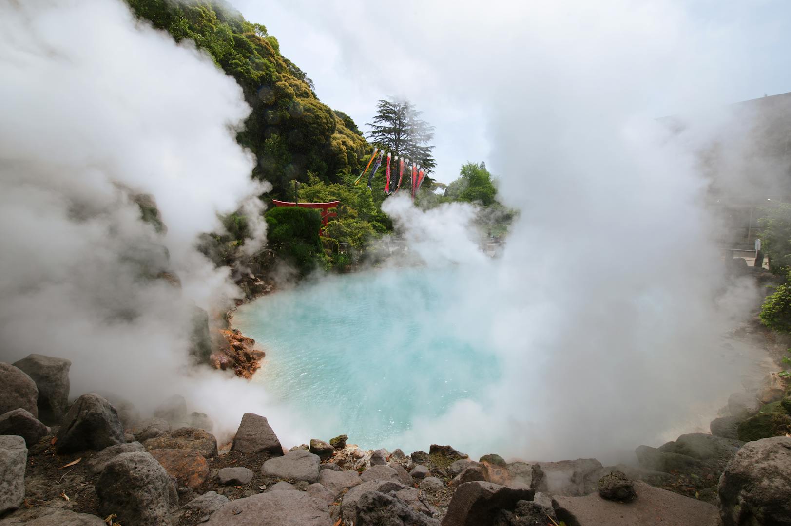 Hell Valley geothermal sulfur pool in Beitou with steam rising from green water