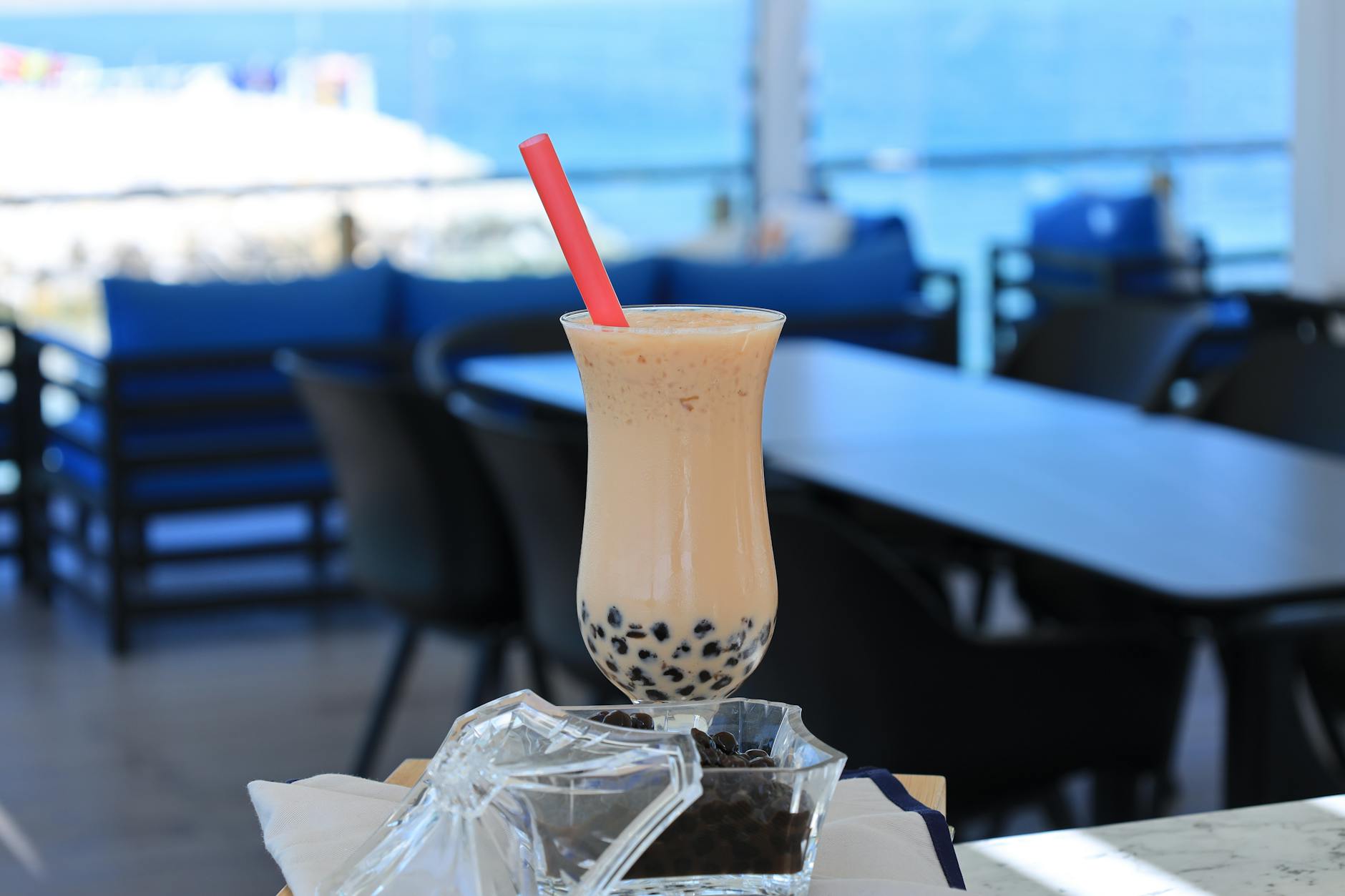 Chilled boba tea with tapioca balls and straw