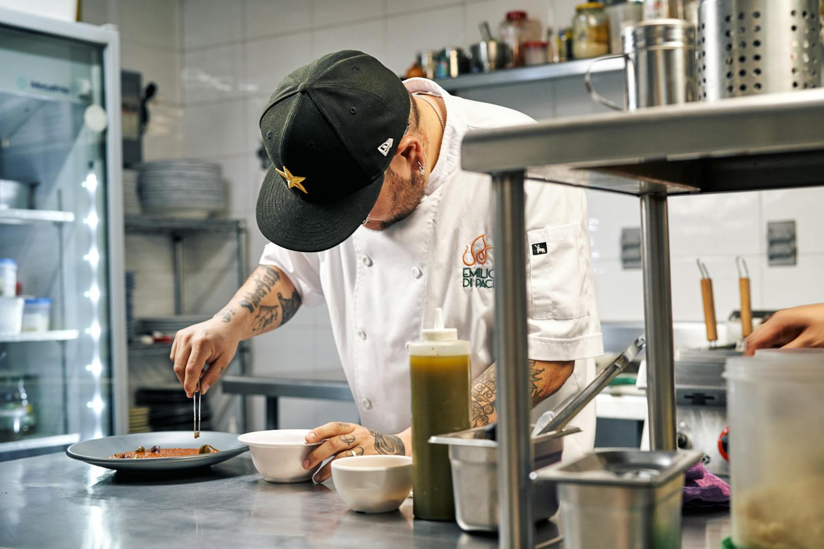 Chef plating a Michelin starred dish at a Taipei fine dining restaurant