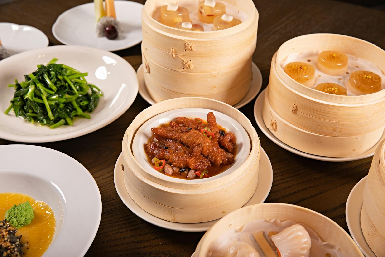 Steamed dumplings and bamboo steamers on a Taipei dim sum table
