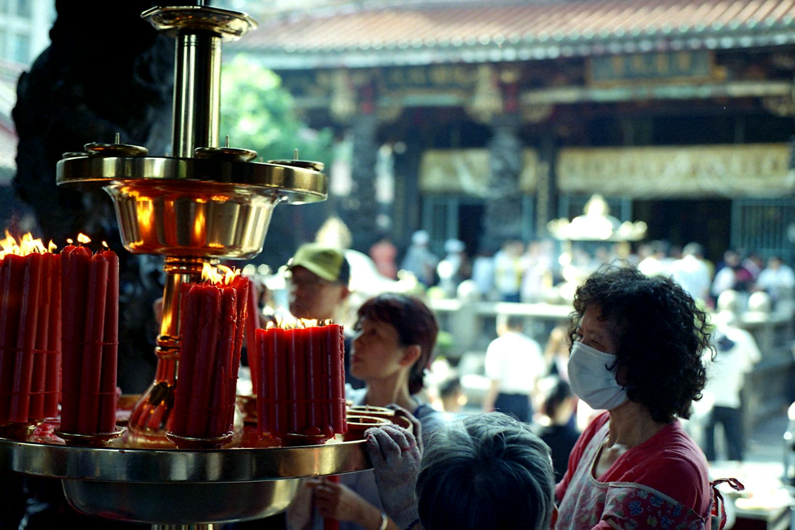 Longshan Temple architecture and worshippers in Taipei free attraction