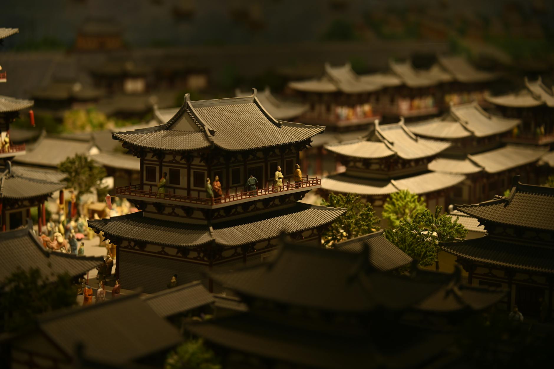 Detailed miniature scene depicting traditional architectural style with figures