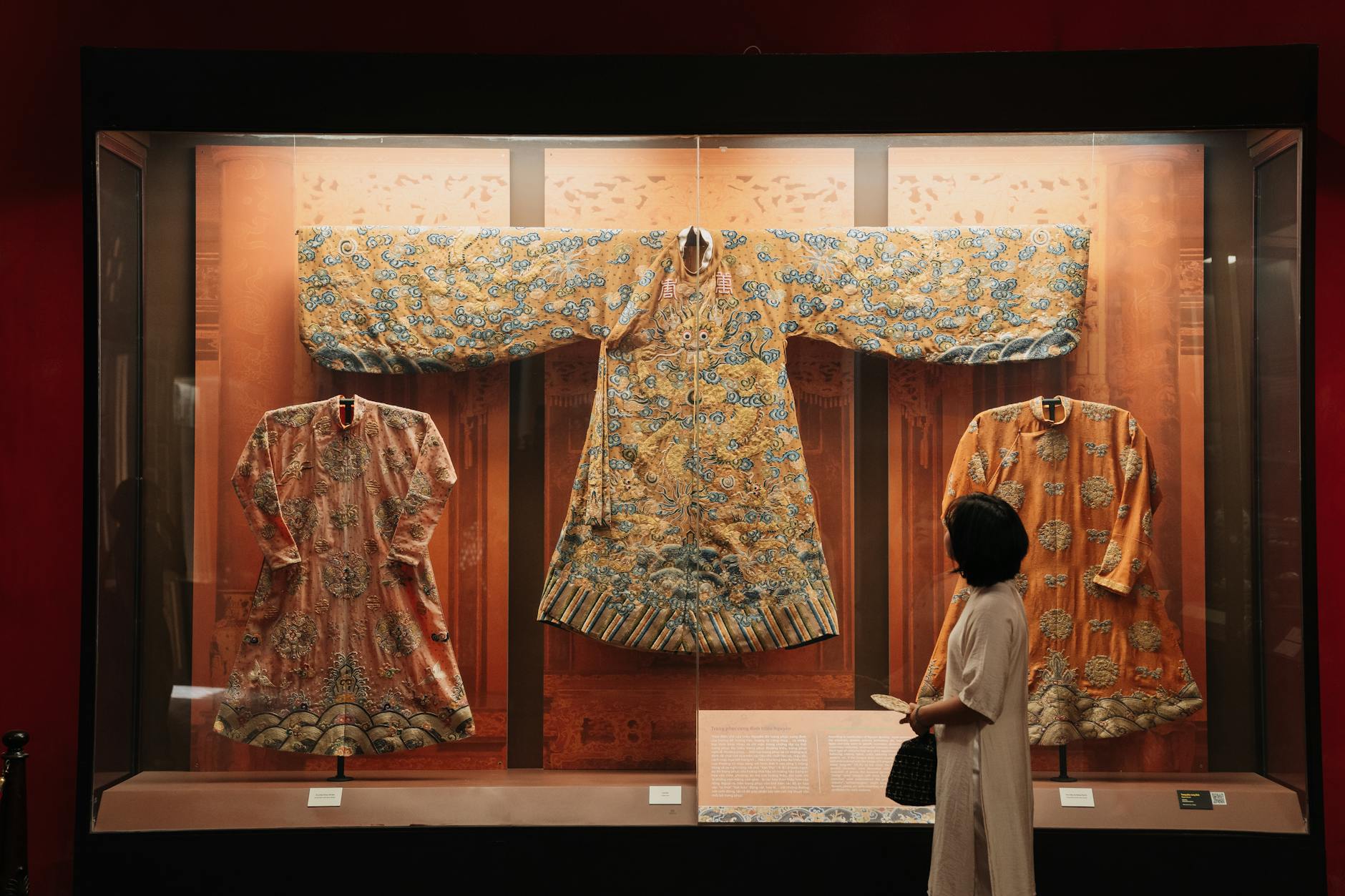 Exquisite traditional Chinese robes displayed in a museum