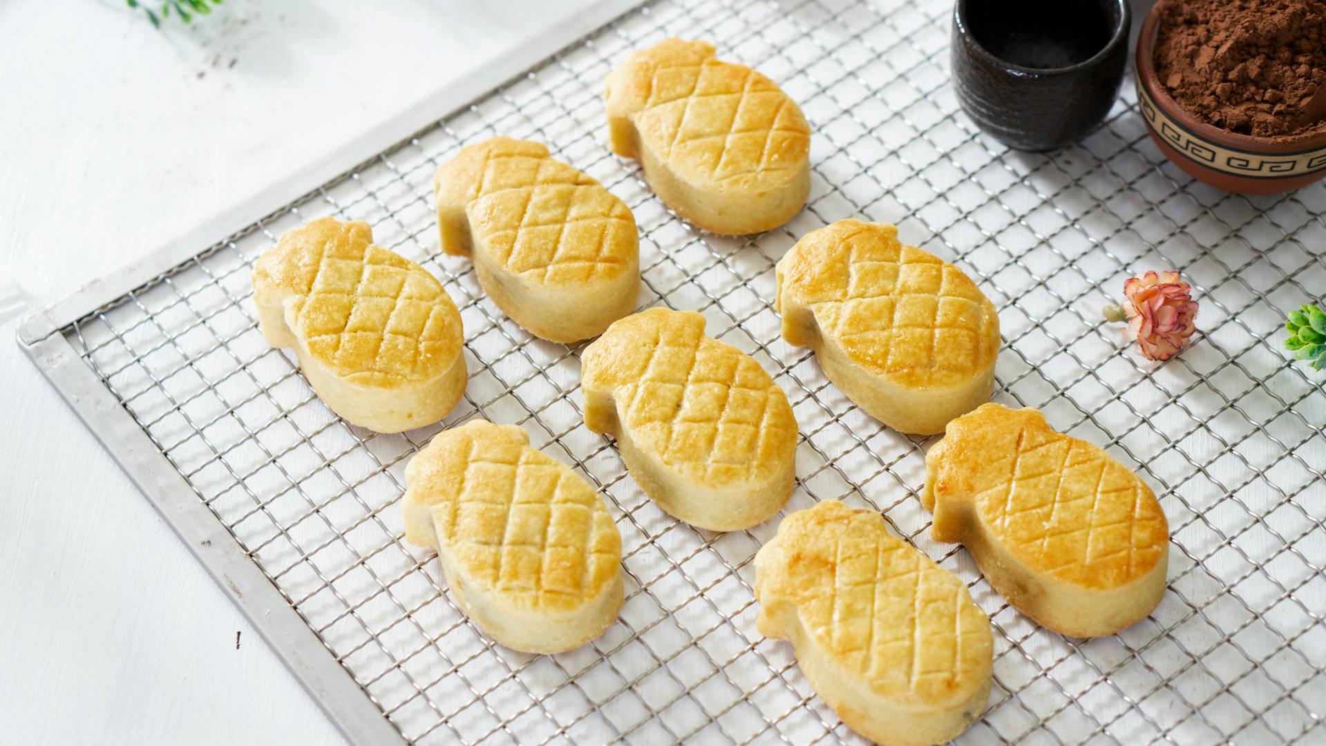 Traditional Taiwanese pineapple cake squares on a plate at a Taipei bakery