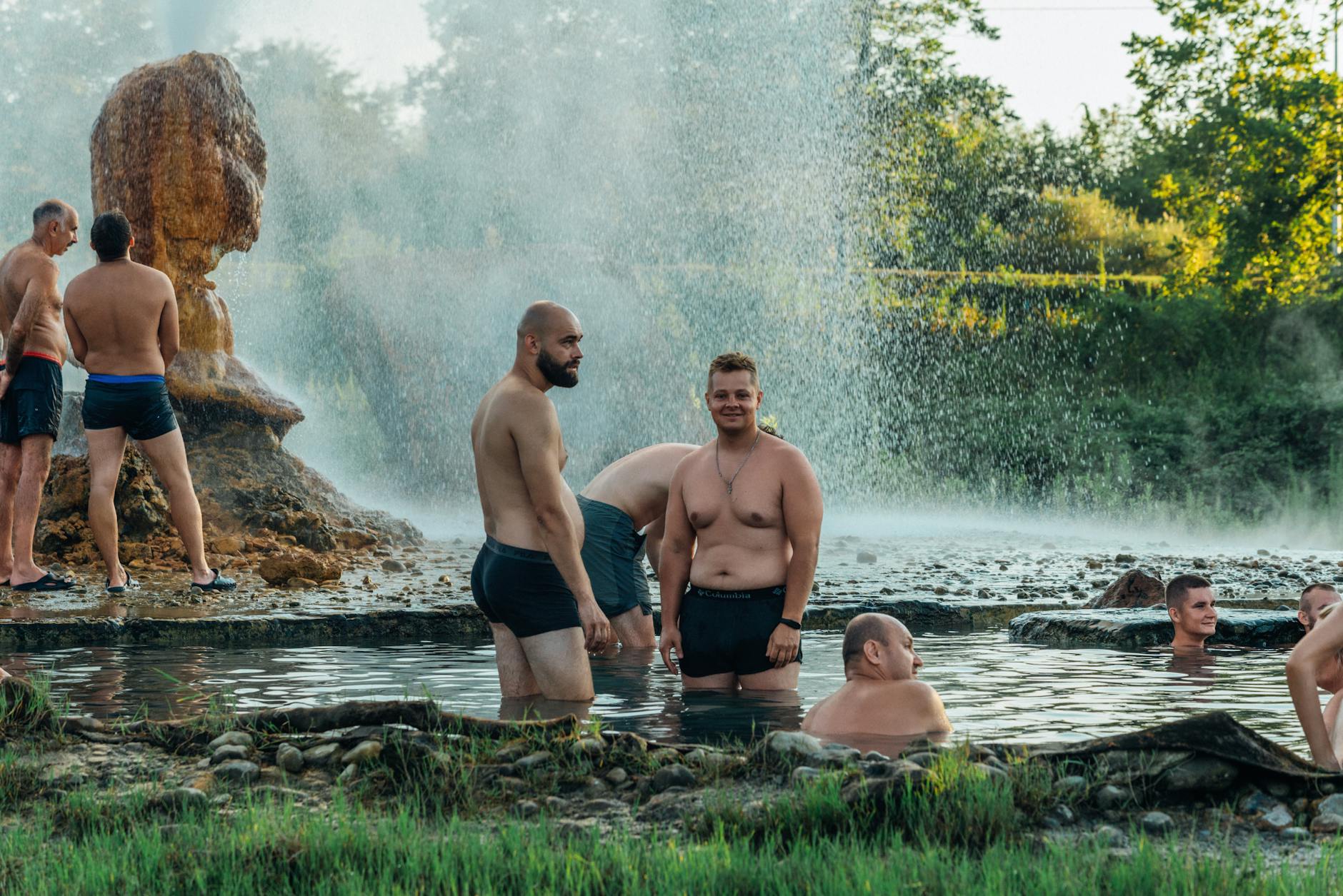 Steaming hot spring pool with natural surroundings