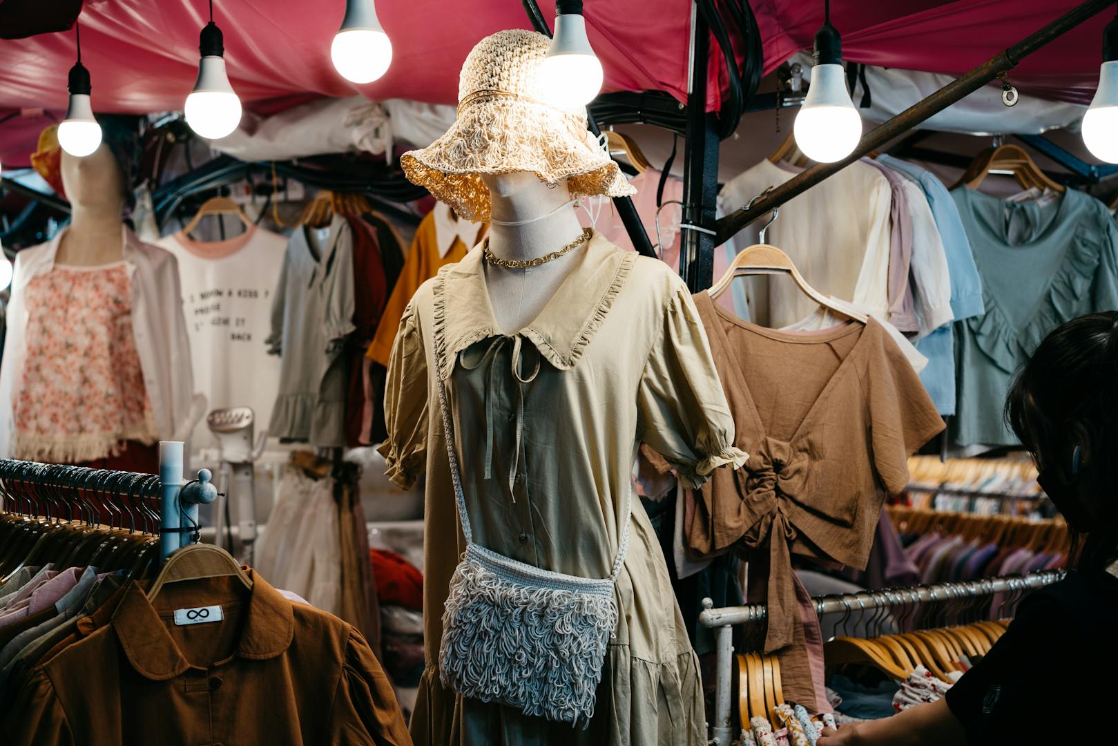 Taipei night market shopping stalls with clothing and accessories