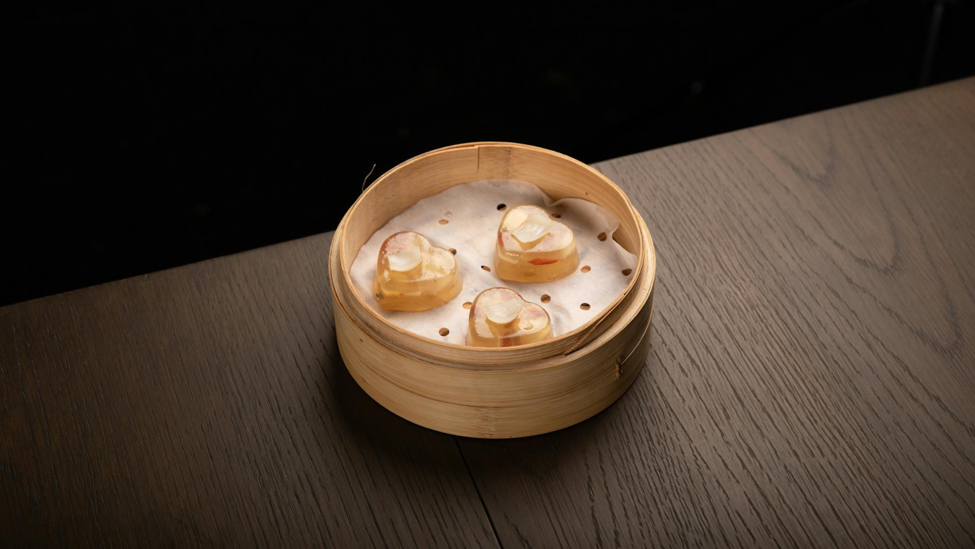 Vegetarian dumplings and dim sum on a bamboo steamer at a Taipei restaurant