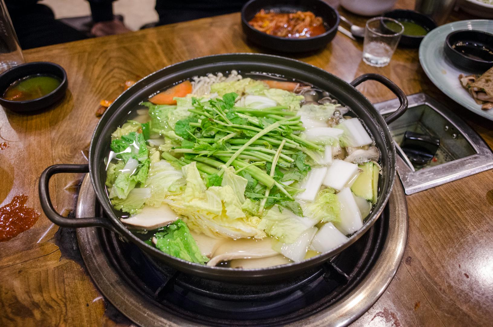 Vegetarian hot pot with mushrooms tofu and fresh vegetables in a Taipei restaurant
