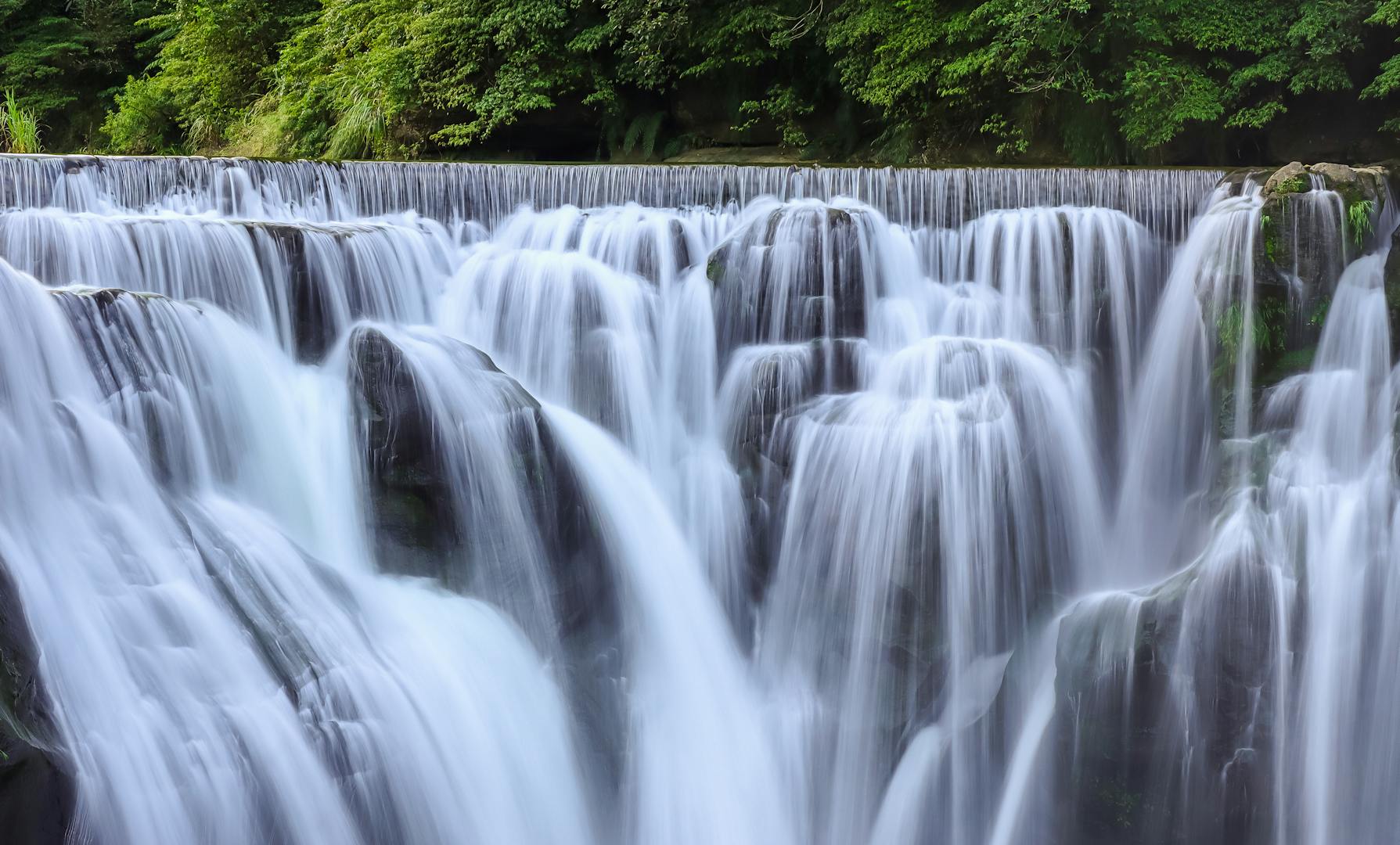 Wulai Waterfall cascading 80m down forest cliff in Taiwan mountains