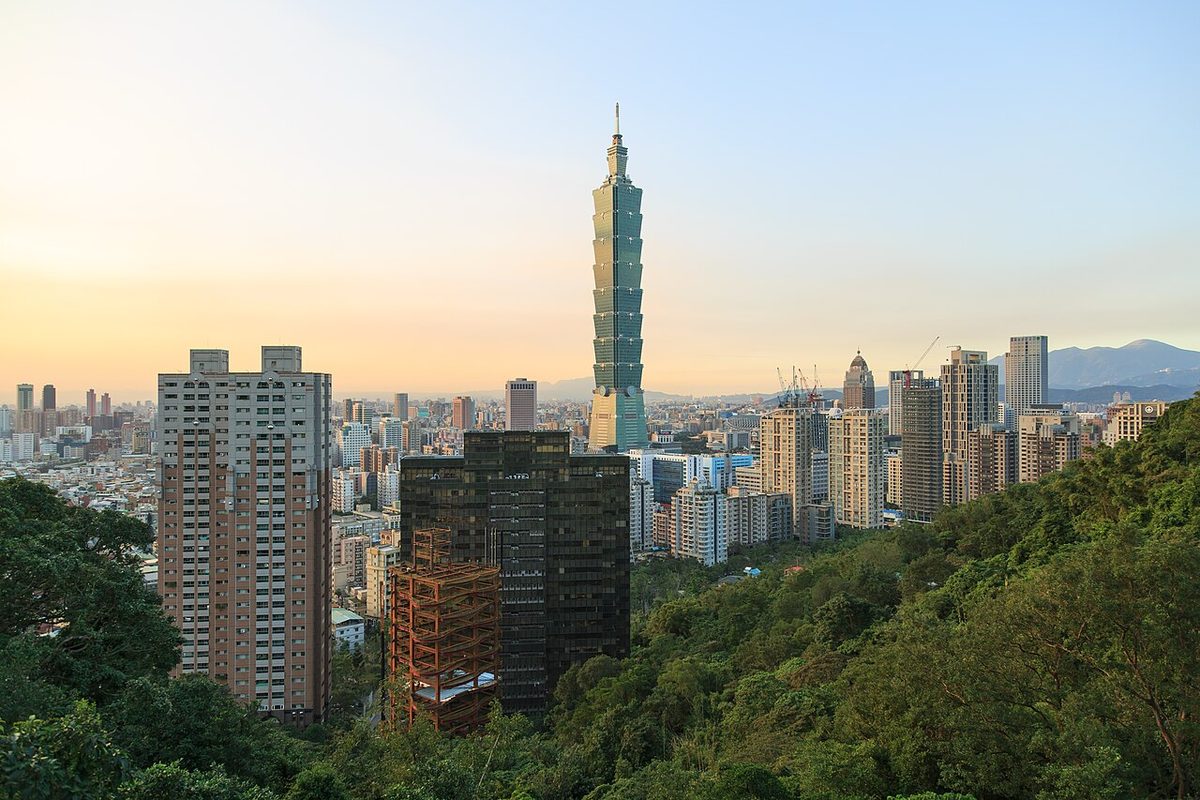 Taipei 101 rising above the city skyline on a humid August evening in Taipei