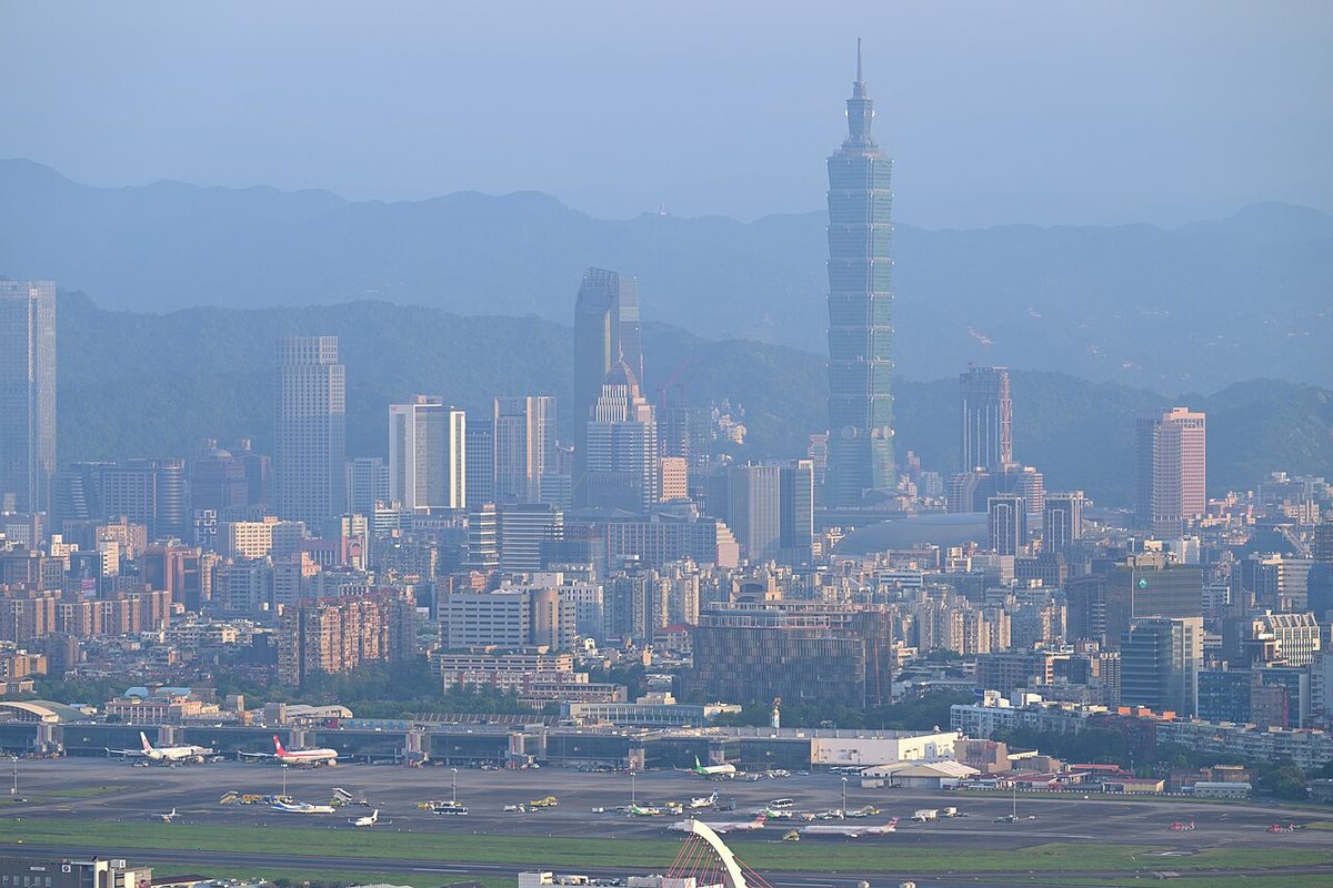 The Taipei 101 tower rising over the Xinyi District skyline near Tonghua Night Market