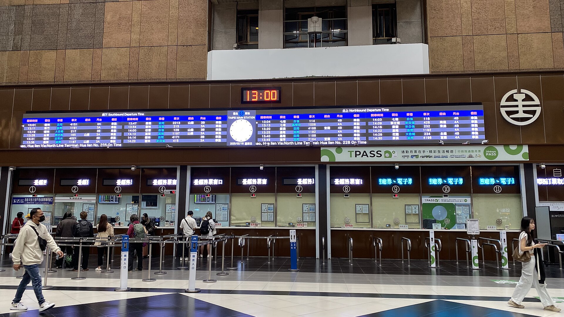 Departure board and ticket windows in the main hall of Taipei Main Station