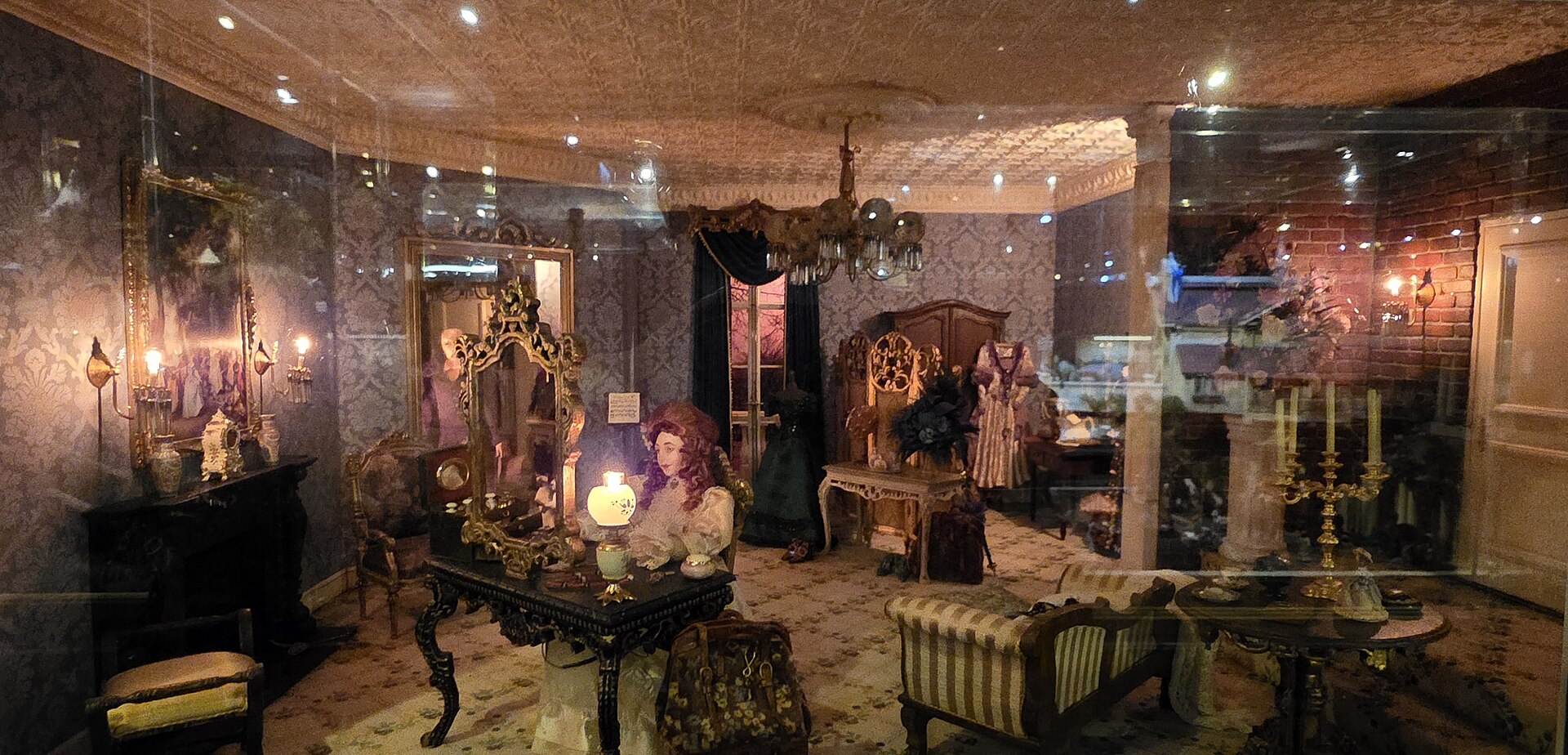 Dolls, mirrors and candlelit furniture fill the Phantom of the Opera miniature room at the Miniatures Museum of Taiwan in Taipei.