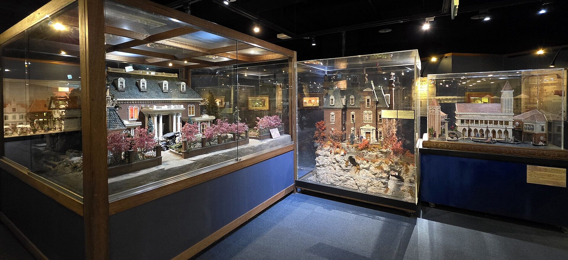 Glass cases display miniature mansions and a Venetian building inside the Miniatures Museum of Taiwan in Taipei.
